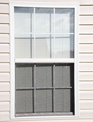 Grilled window with white and grey color shades and a white border 
